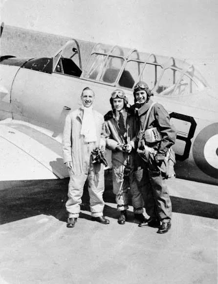 Sydney S. Shulemson (left) and fellow trainees with North American Harvard aircraft, No. 14 Service Flying Training School, RCAF