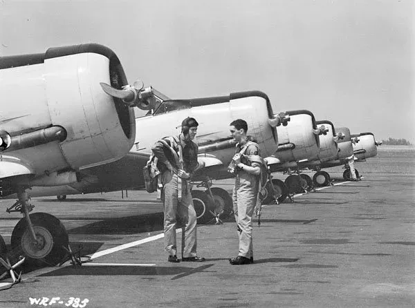 Instructor and student with North American Harvard II aircraft of No. 2 Service Flying Training School, RCAF, Uplands, Ontario, July 1941