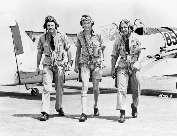 Unidentified pilots with a North American Harvard II aircraft at No. 31 Service Flying Training School, RCAF, Single Engine Bombing Competition