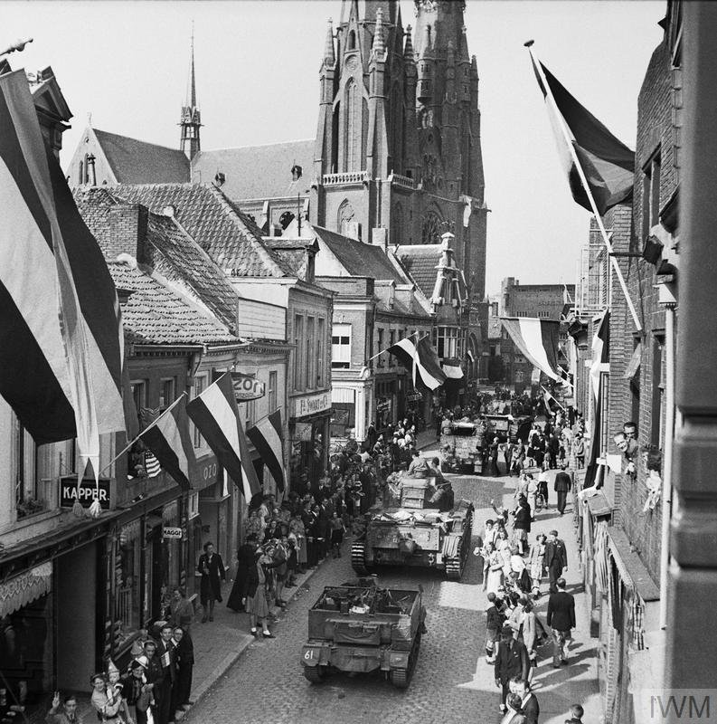 Eindhoven 17 - 18 September 1944: The people of Eindhoven line the streets of the town to watch armoured vehicles of British XXX Corps pass through. The 101st (US) Airborne Division had captured the town on the previous day.