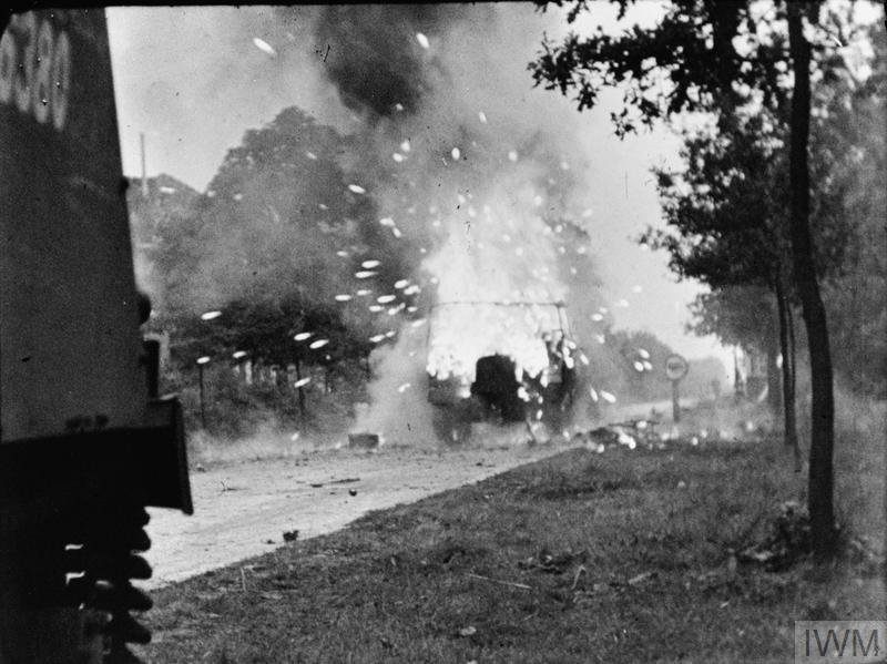 A Loyd carrier of the anti-tank platoon of 3rd Battalion, Irish Guards explodes during 30 Corp's advance up the Eindhoven road at the start of Operation 'Market-Garden', 17 September 1944.