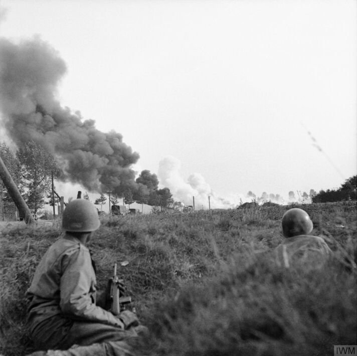 A convoy of lorries under enemy artillery and mortar fire on the road between Son and Eindhoven, 20 September 1944.