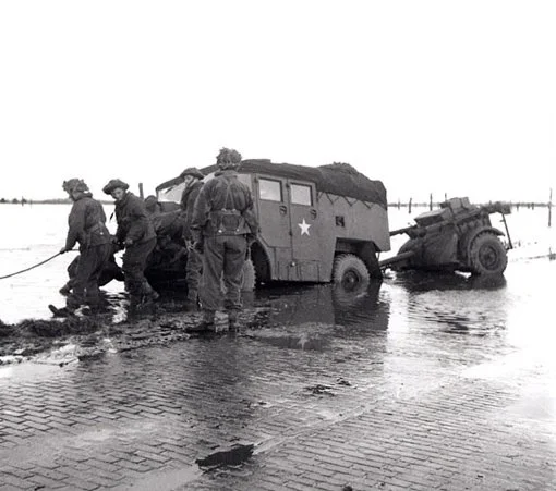 A gun-tractor skidded off the road on the flooded island of Beveland, October 28th, 1944