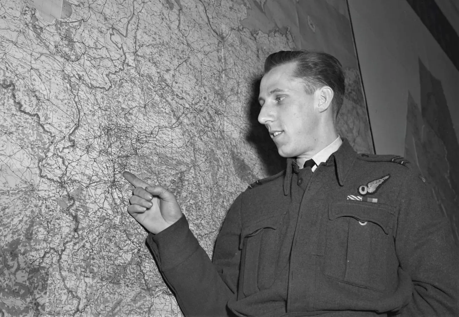 F/L Victor Rolfe reviewing a map at No. 6 Group Headquarters, Allerton Park, Yorkshire