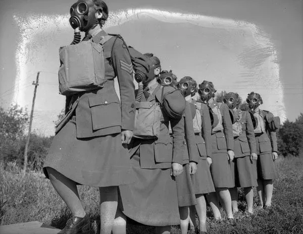 Personnel entering a gas chamber during a training exercise, No. 2 CWAC Basic Training Centre, Vermilion, Alberta, July 1943