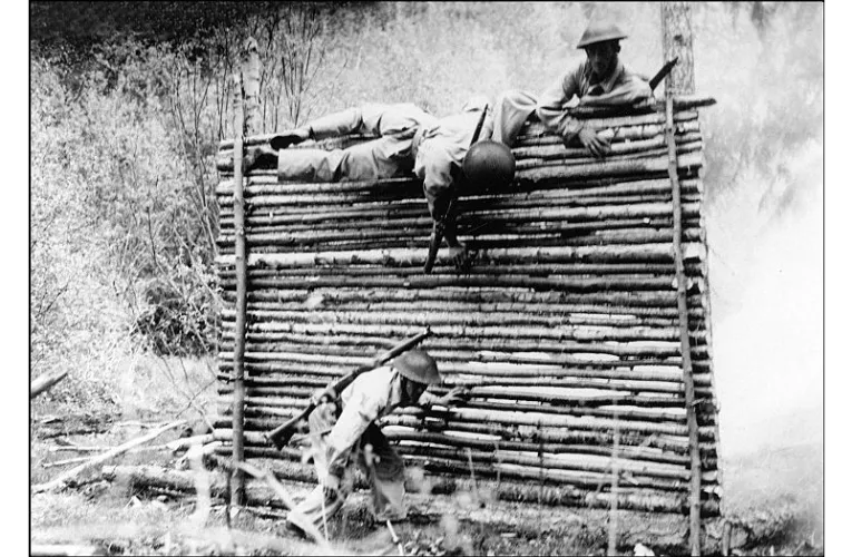 Soldiers scaling a wooden wall while training at Canadian Battle Drill School near Coldstream Ranch — Image Courtesy: Museum and Archives of Vernon