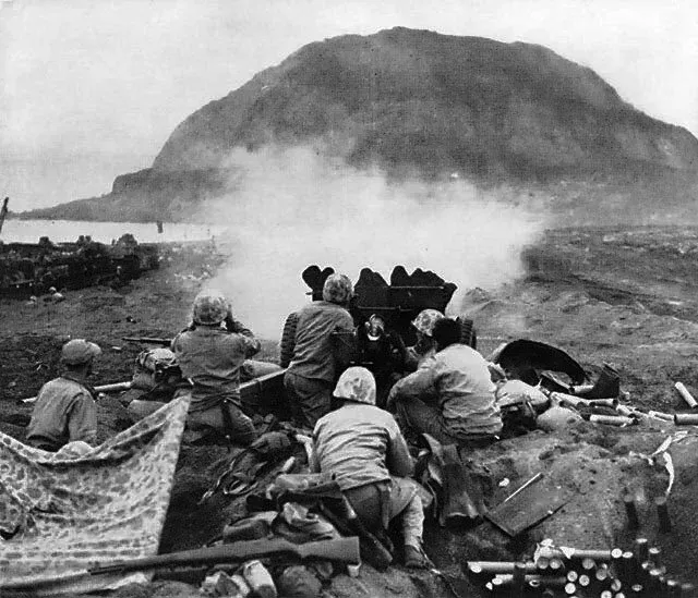 37mm gun fires against cave positions at Iwo Jima