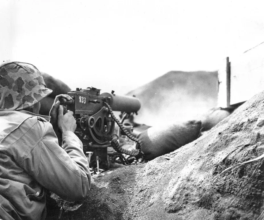 A U.S. Marine firing his Browning M1917 machine gun at Japanese positions on Iwo Jima