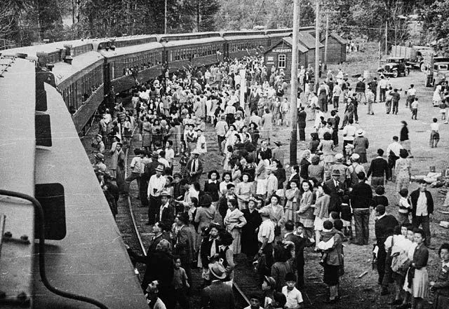 Japanese-Canadians being relocated to camps in the interior of British Columbia