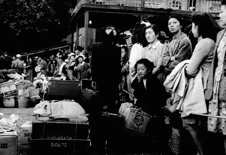 Group of Japanese immigrants who were interned in World War II, waiting for a train to take them to ships bound for Japan, 1946