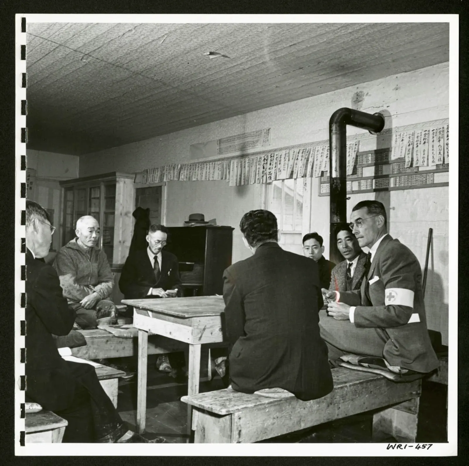 In the Buddhist church at Picture Butte, Alberta, a committee meeting with Japanese-Canadian delegates
