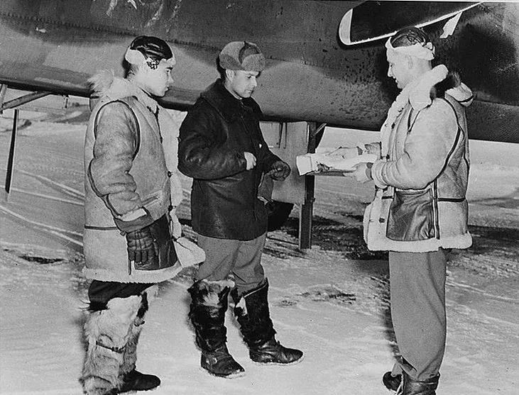 Lieutenants Susin and Karpov of the Russian force and Sergeant Alex Homonchuk at Ladd Airfield, Alaska