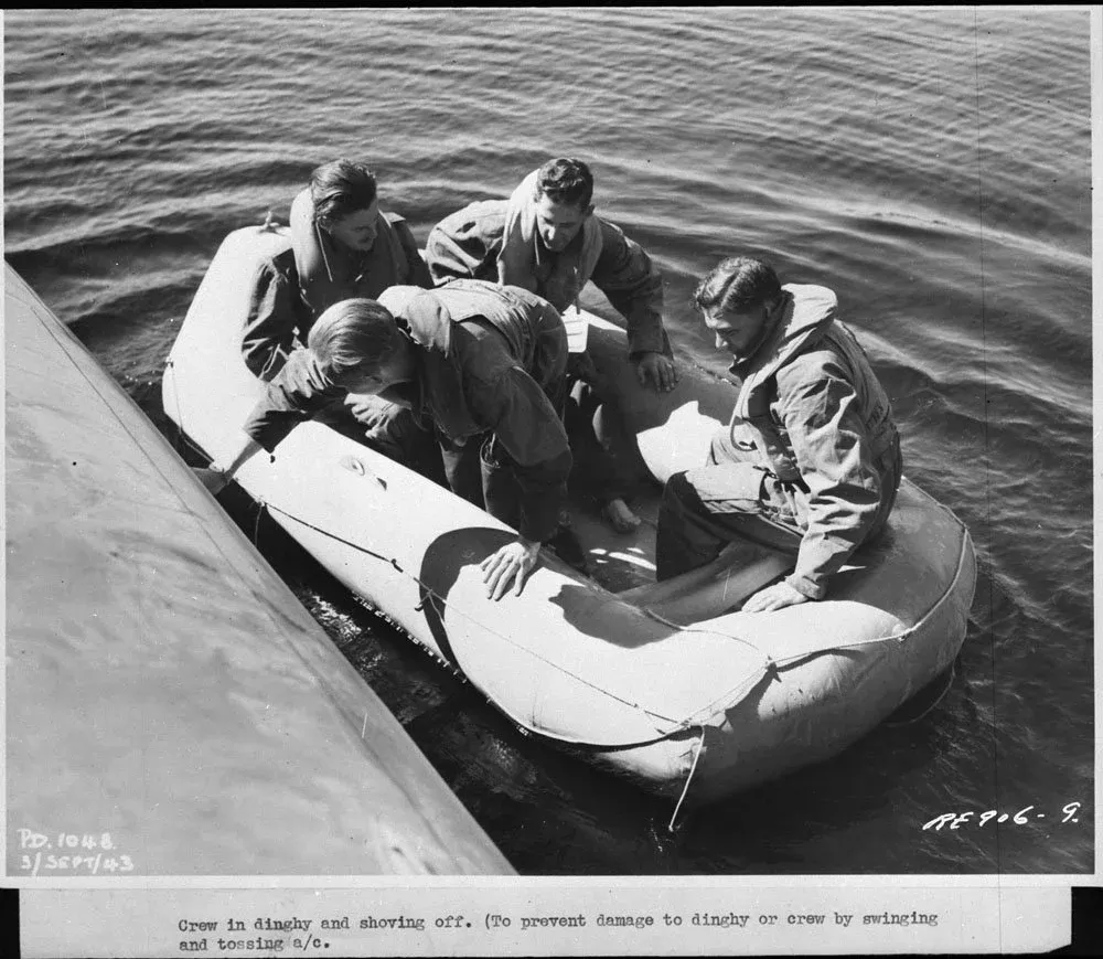 Personnel testing an emergency dinghy in the Ottawa River, Test and Development Establishment, RCAF Station Rockcliffe, Ontario, 29 November 1943