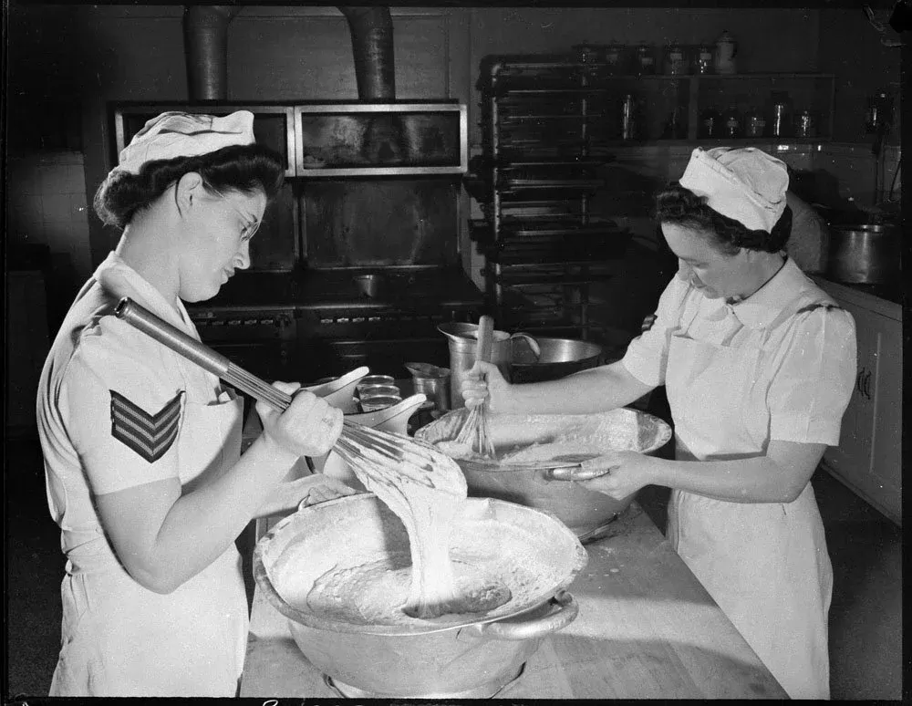 Unidentified airwomen preparing food in the test kitchen, No. 1 Nutritional Laboratory, RCAF, Guelph, Ontario, 3 April 1944