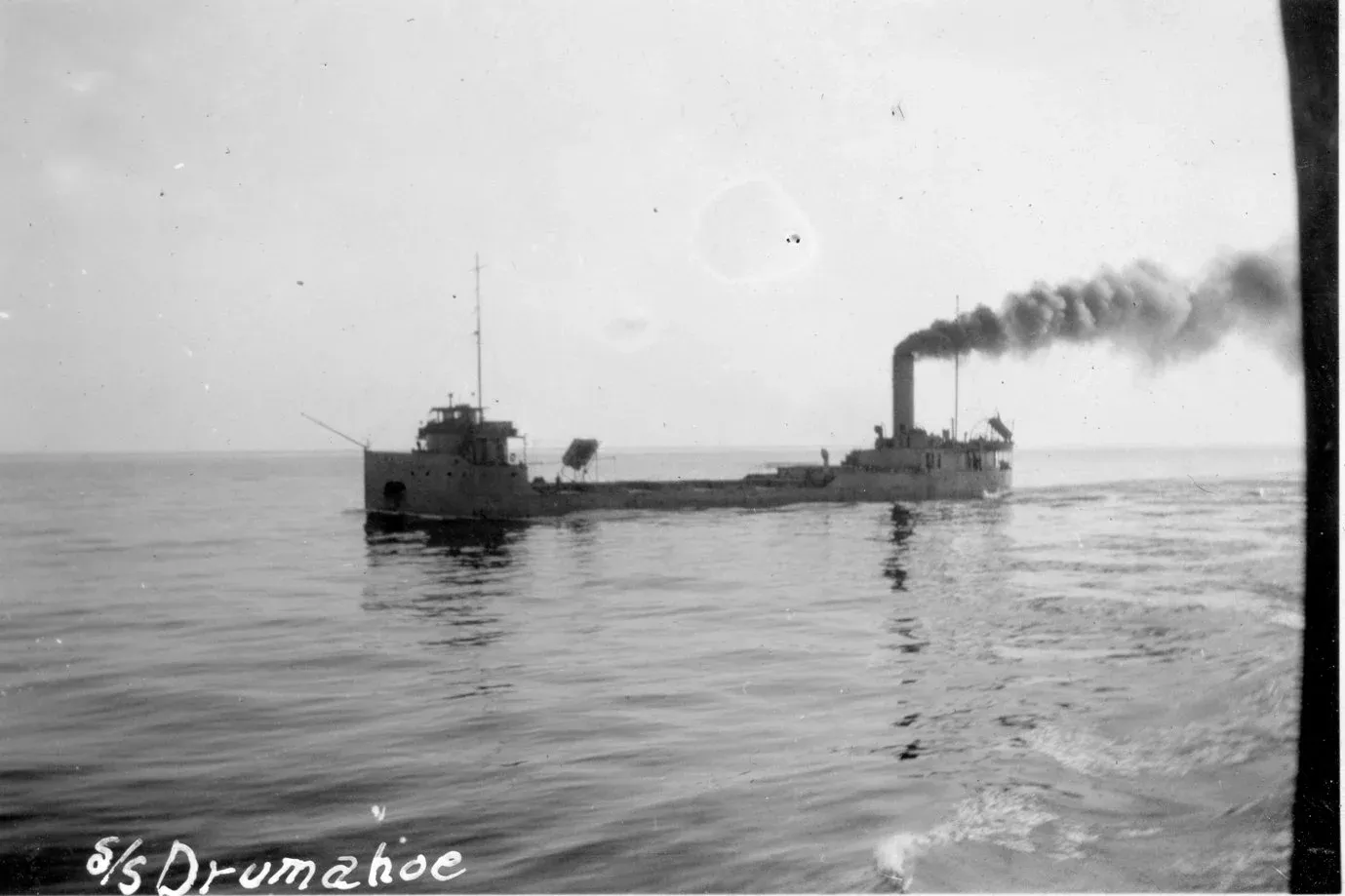 SS Drumahoe underway to join an ocean convoy out of Sydney Harbour in wartime colours, 1942, photographed from HMCS Wasaga