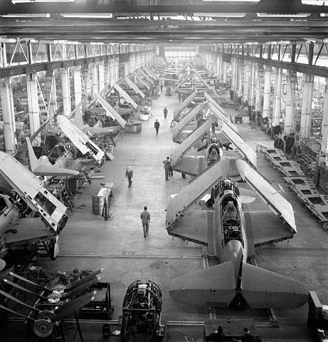 A Curtiss SB2C-1 Helldiver aircraft nearing assembly on the production floor of Canadian Car and Foundry Company Ltd