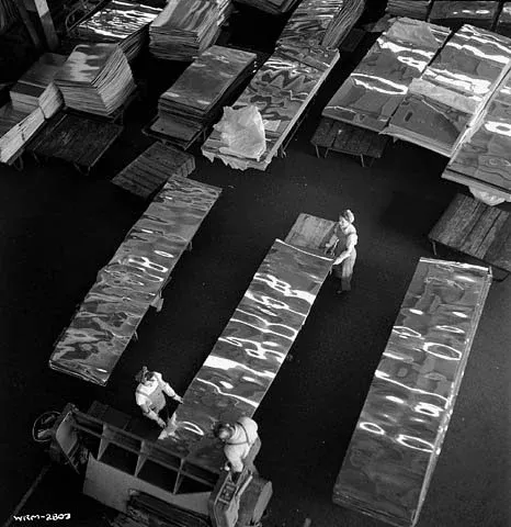 Workers scribing aluminium sheets on the cutting tables of the rolling mill at the Alcan Aluminum Limitée plant