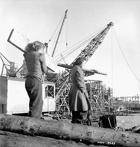Women workers carry lumber for construction of the keellaying berth at Pictou shipyard